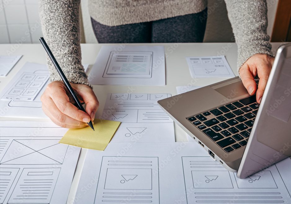 Web Designer Web Designer concept - write on post it notes about a website builder project