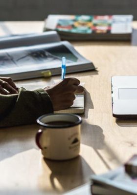 Create a content creation strategy concept - person writing at desk