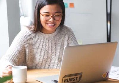 happy person on computer: website is working concept